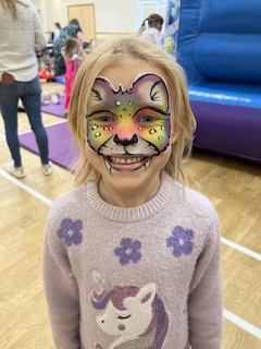 girl with rainbow leopard face paint in Shrewsbury